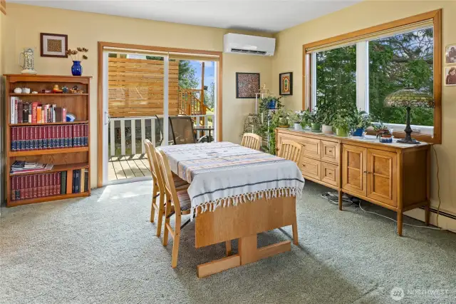 Sliding door off the dining space leads to side deck with backyard access.