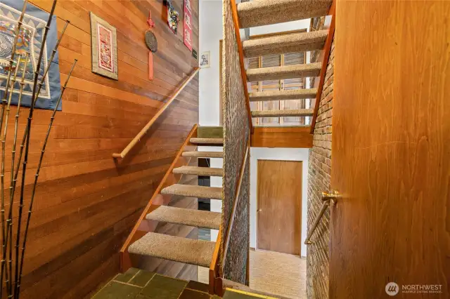 T&G wood on the walls of the entry add character to this beautiful home.