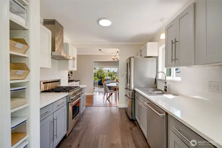 Main Level Kitchen Showcasing High-end Appliances. (Bosch Dishwasher and 1 year young Refrigerator)