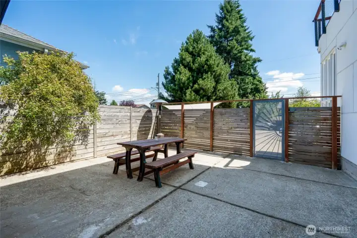 Gated entry from the front of the home leads directly to the backyard.