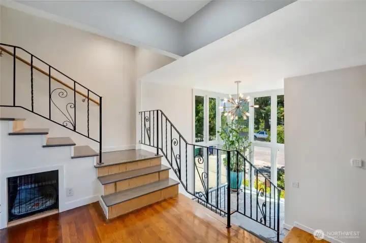 Stair Case overlooking the split entryway. Stairs can be taken inside the home to the lower level. Additional Stairs lead to the 2nd Floor 2019 newly constructed floor.