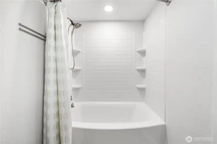 The full bathroom is attached to the primary bedroom and is also accessible from the hallway