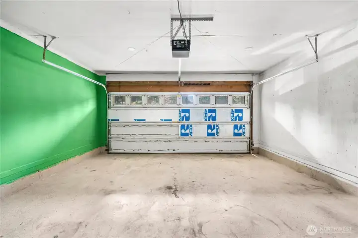 Large garage with space for storage or tools