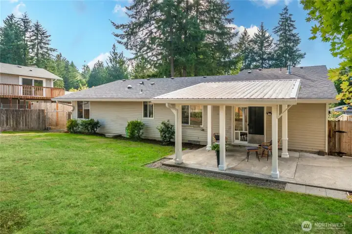 The back yard offers room for gardening relaxation or play