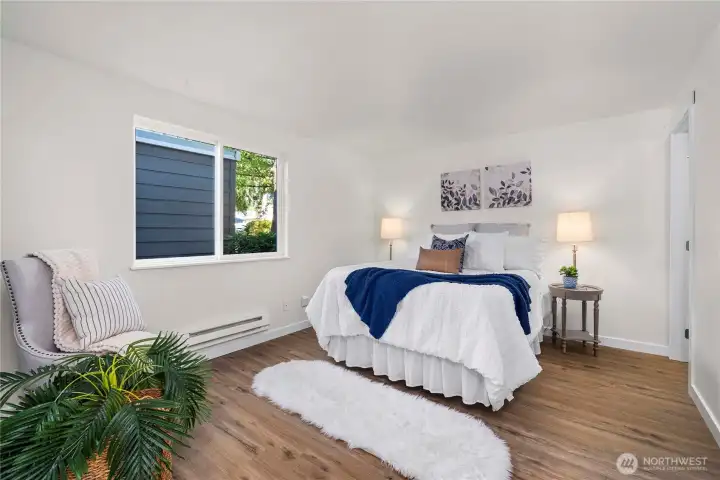 The Primary bedroom is a actually a suite, complete with 3/4 bath, workspace and HUGE walk-in closet.