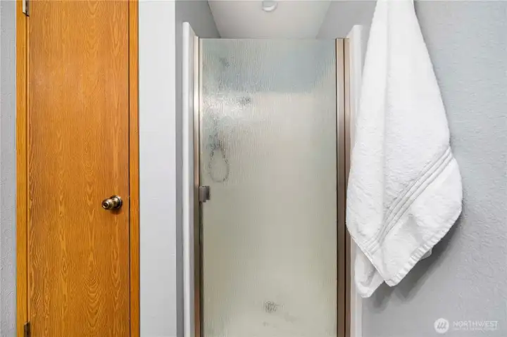 Glass walk-in shower in the private primary bath.