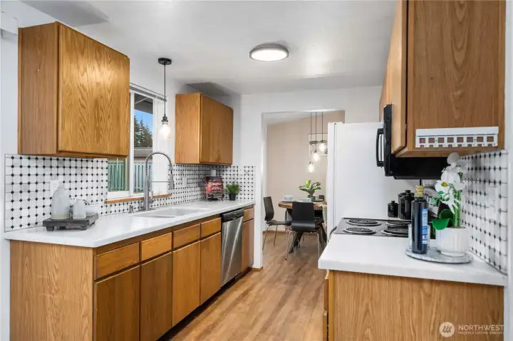 Cozy kitchen that maximizes cabinet and counter space.