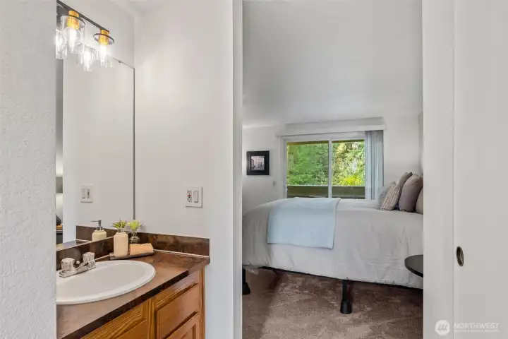 Separate Vanity located in Primary Bedroom.