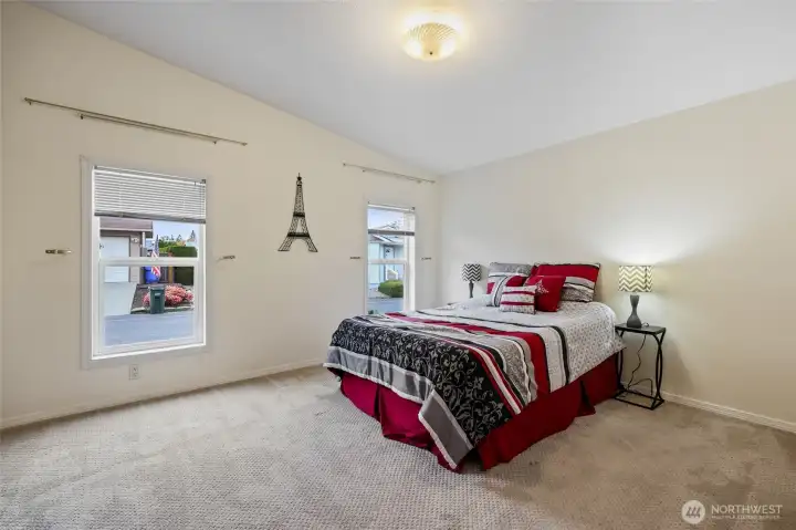 Primary bedroom has lots of light