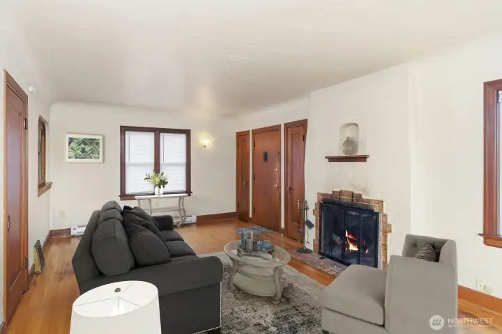 1st floor living room with wood burning fireplace.