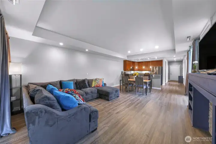 Wide open great room with updated flooring and recessed lighting, creating a bright and inviting main level.