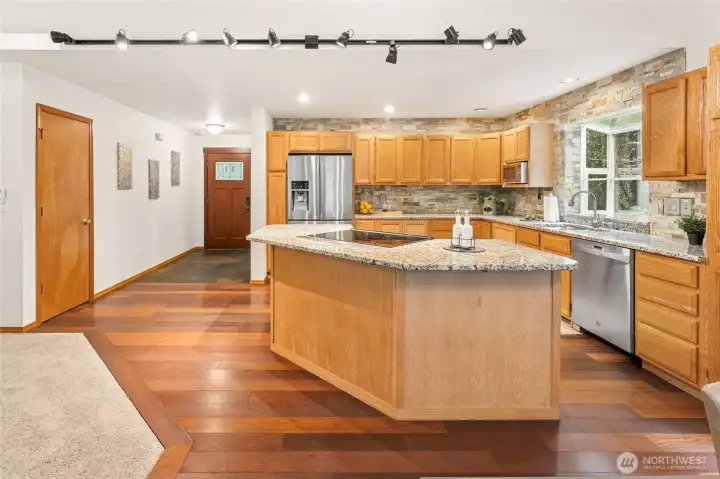The island cooktop makes this kitchen a natural gathering spot for conversation.