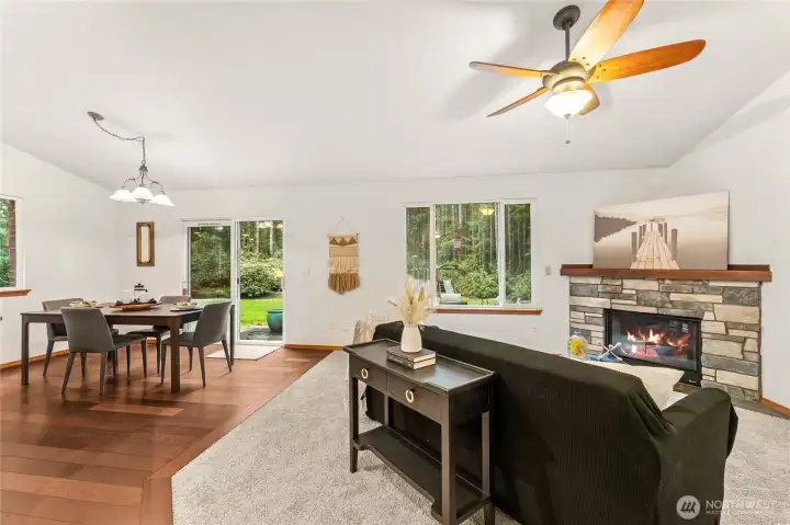 The open-concept of the living room, dining, and kitchen offers seamless flow for daily life and gatherings.