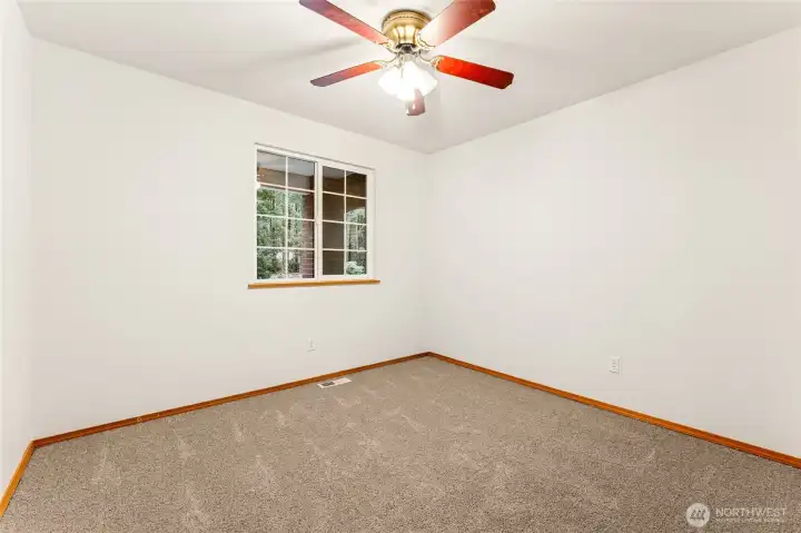 One of two generously sized extra bedrooms.