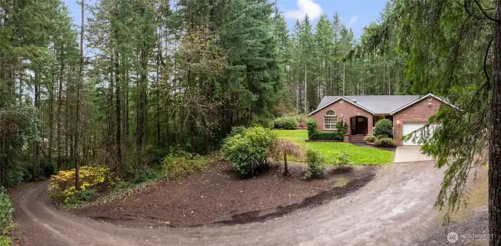 Scenic driveway welcomes you to this beautiful and secluded residence.