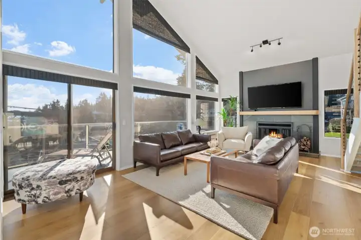 Floor-to-ceiing windows add natural light throughout much of this condominium home.