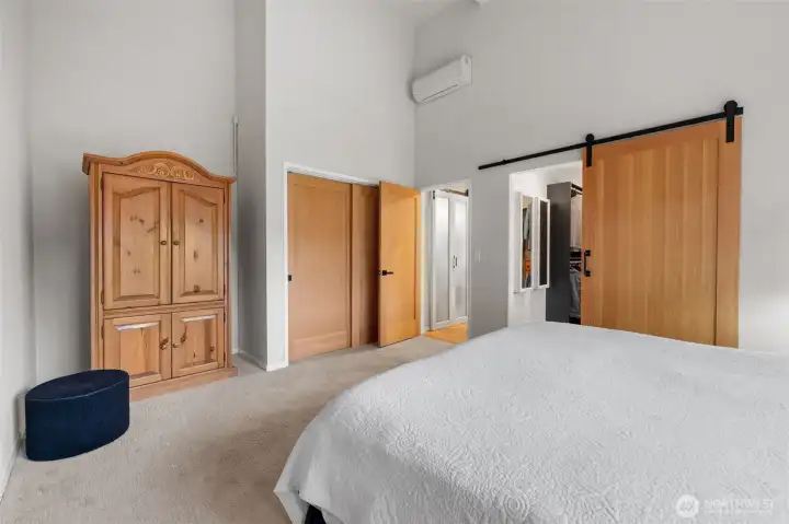 A second handcrafted sliding door that leads to the walk-in closet and bath.