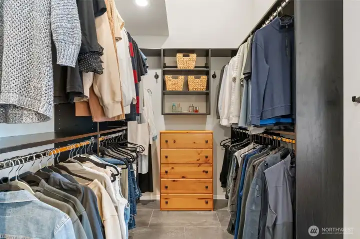 Walk-in closet with custom designed closet.
