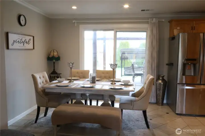 Spacious dining area opens up to back yard