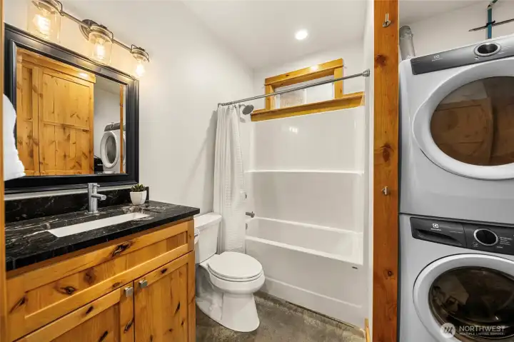 Main floor full bath with laundry.