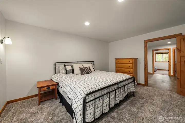 Spacious upper level bedroom 2 with king-sized bed.