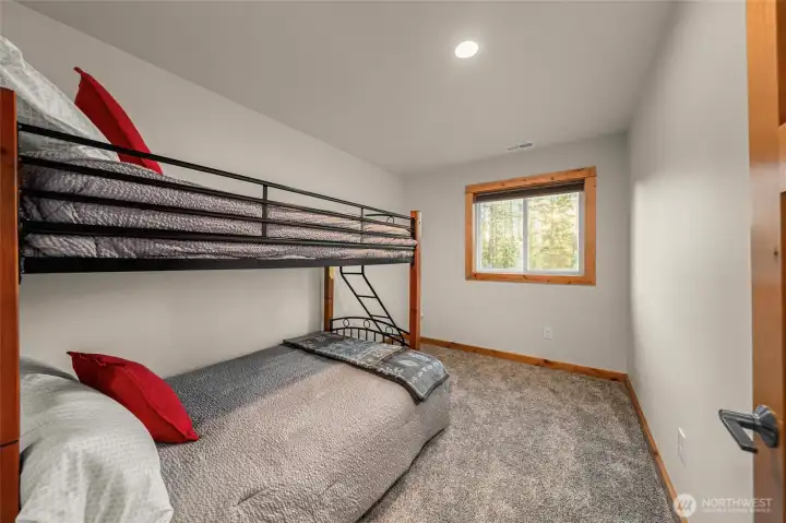 Upper level bonus bunkroom with a twin over full bunkbed.