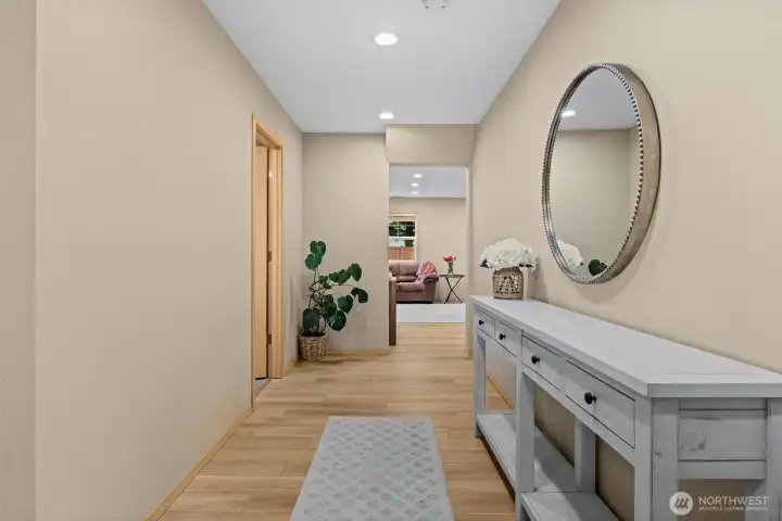 A bright and airy foyer provides a warm welcome for guests and a seamless transition into the heart of the home