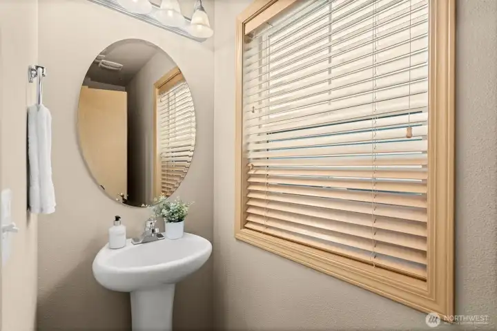Cute half bathroom located just in the foyer