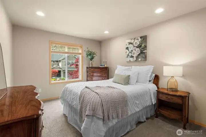 The perfect blend of cozy and airy—this well-appointed bedroom serves as a quiet haven away from the bustle of the main living areas