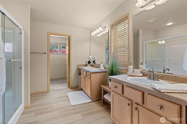 Step into serenity in this light-filled ensuite, where high-end materials and a clean aesthetic create a calming, resort-style atmosphere