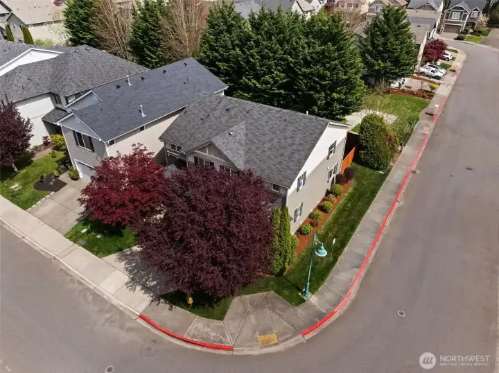 Situated on a generous corner lot, this home benefits from extra breathing room and beautiful curb appeal from every angle