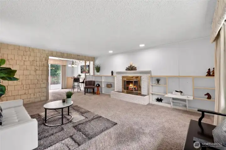 Warm, welcoming entry opens into the main living space, where the open layout connects the front door, seating area, and dining room for easy everyday flow.