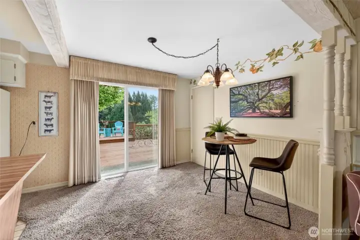 Sunny dining nook overlooks the backyard and offers direct access to the oversized deck, making it the perfect spot for morning coffee, weeknight dinners, or summer BBQs. Door leads out to the one car garage.