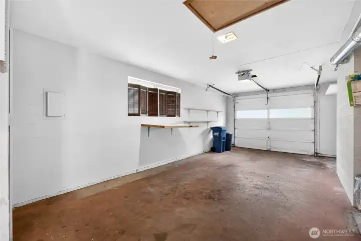 Oversized attached garage offers excellent storage, workshop potential, and convenient parking.
