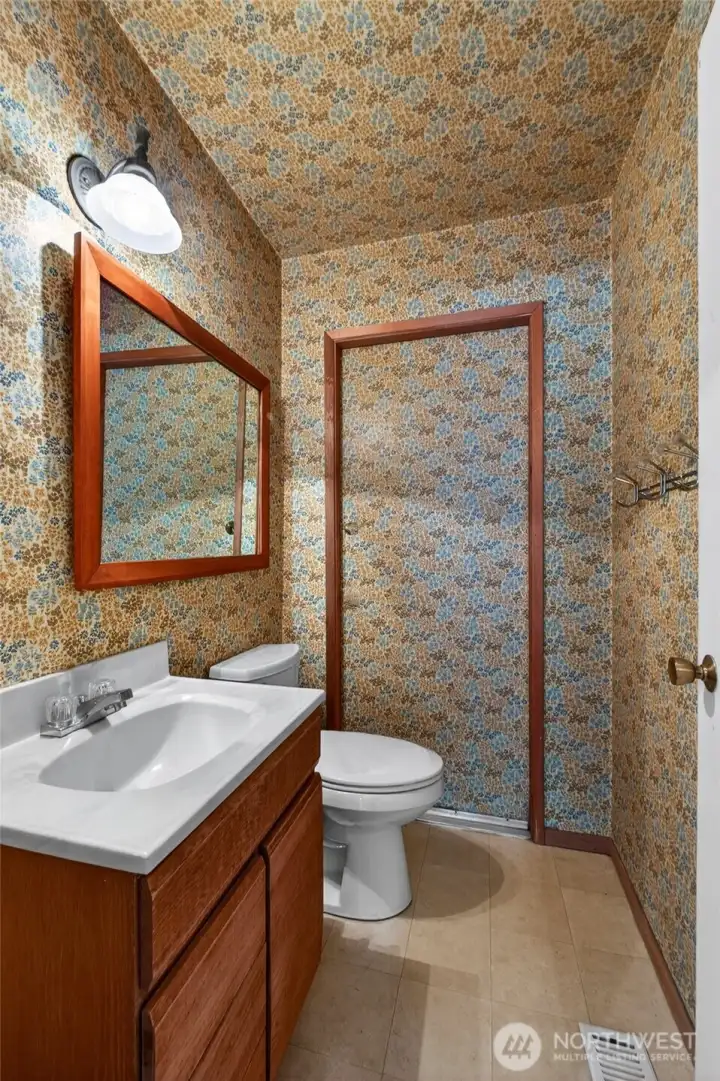 Additional bathroom with vintage character and plenty of opportunity to personalize and make it your own. Easy access to backyard for the hot tub.