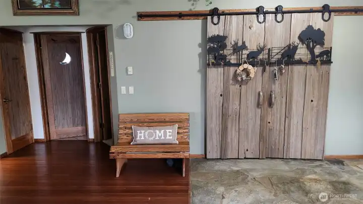 The home is finished with elegant custom tile and wood flooring