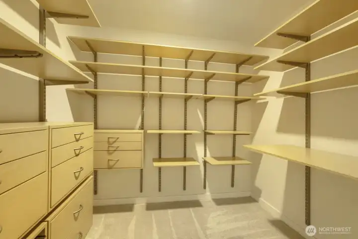 Don't miss the large walk-in closet for the primary bedroom, complete with custom shelving.