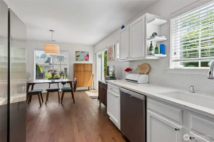 Updated sink and backsplash create a clean, modern, and cohesive design.