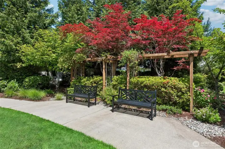 Peaceful seating areas placed throughout the neighborhood for rest and relaxation.