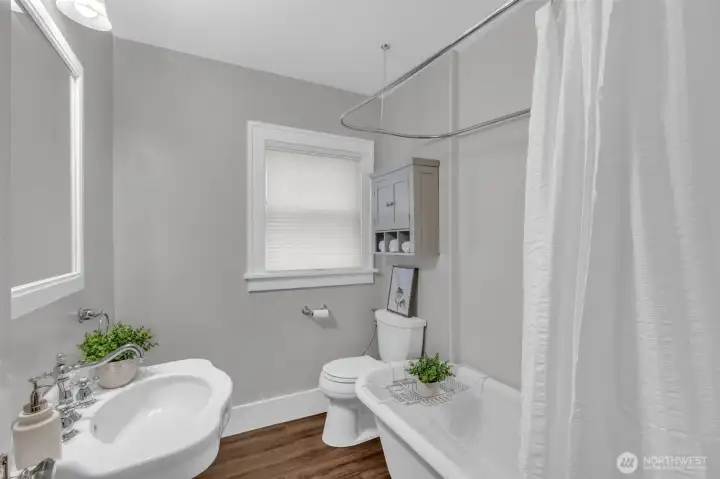 Updated full bathroom with vintage claw foot tub/shower