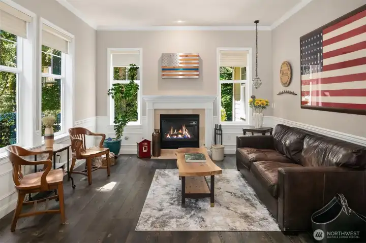 As you walk in the front to the left is a flexible space -- could be a work from home. Propane fireplace is warming, tall ceilings and windows offer balance to the rich wide plank floor. As you walk in the front to the left is a flexible space -- could be a work from home. Propane fireplace is warming, tall ceilings and windows offer balance to the rich wide plank floor.