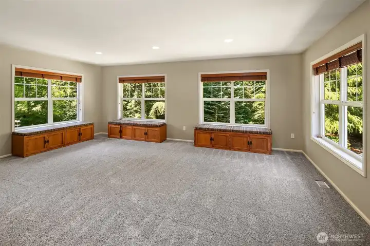 Monster bonus room -- Not pictured is a large craftsman entertainment unit that matches the window seats. This is above a large three car garage so @690 sq ft?? Monster bonus room -- Not pictured is a large craftsman entertainment unit that matches the window seats. This is above a large three car garage so @690 sq ft??