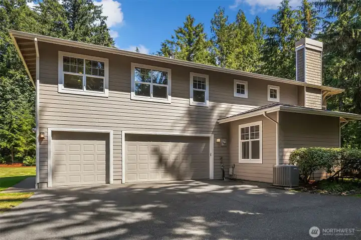 Some functionality too -- Three-car oversized garage with overhead storage, generator ready, AC Some functionality too -- Three-car oversized garage with overhead storage, generator ready, AC