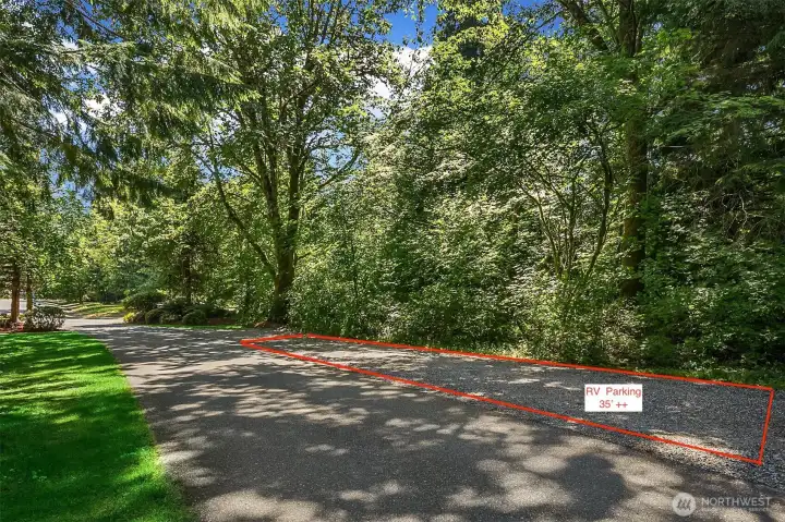 They park their 35' Camper here and a large pick-up truck. This property is designed for those that have or desire toys! They have parking (not shown) for trailers. You could easily you have the room to build a shop on this property that would have excellent access from the driveway and coule or could not be seen by the main house. They park their 35' Camper here and a large pick-up truck. This property is designed for those that have or desire toys! They have parking (not shown) for trailers. You could easily you have the room to build a shop on this property that would have excellent access from the driveway and coule or could not be seen by the main house.
