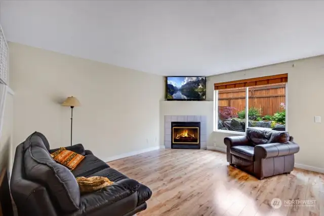 Spacious living room with gas fireplace.