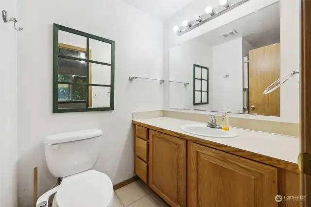 Primary bath has single vanity and a shower