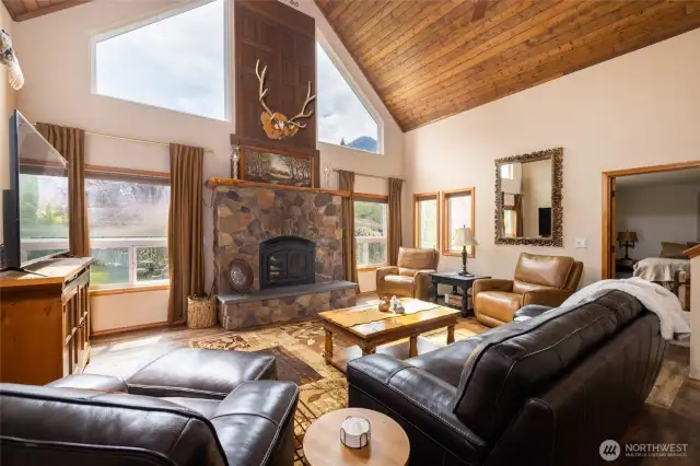 Grand fireplace with large windows for the mountain views beautiful tongue & groove vaulted ceilings