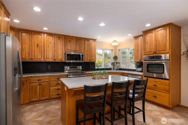 Large kitchen with island and double oven.