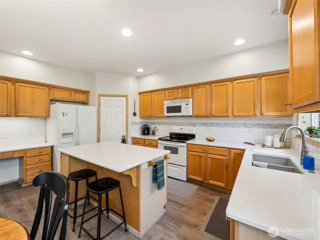 Lots of counter space & cabinets!!  Including a desk workspace for household organization (we call it a command center!)