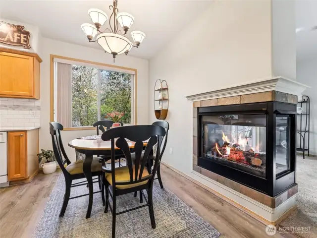 Ample dining space cozies up to the 3-sided gas fireplace!